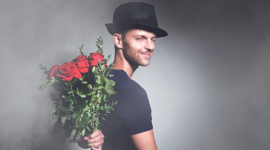 man with red roses